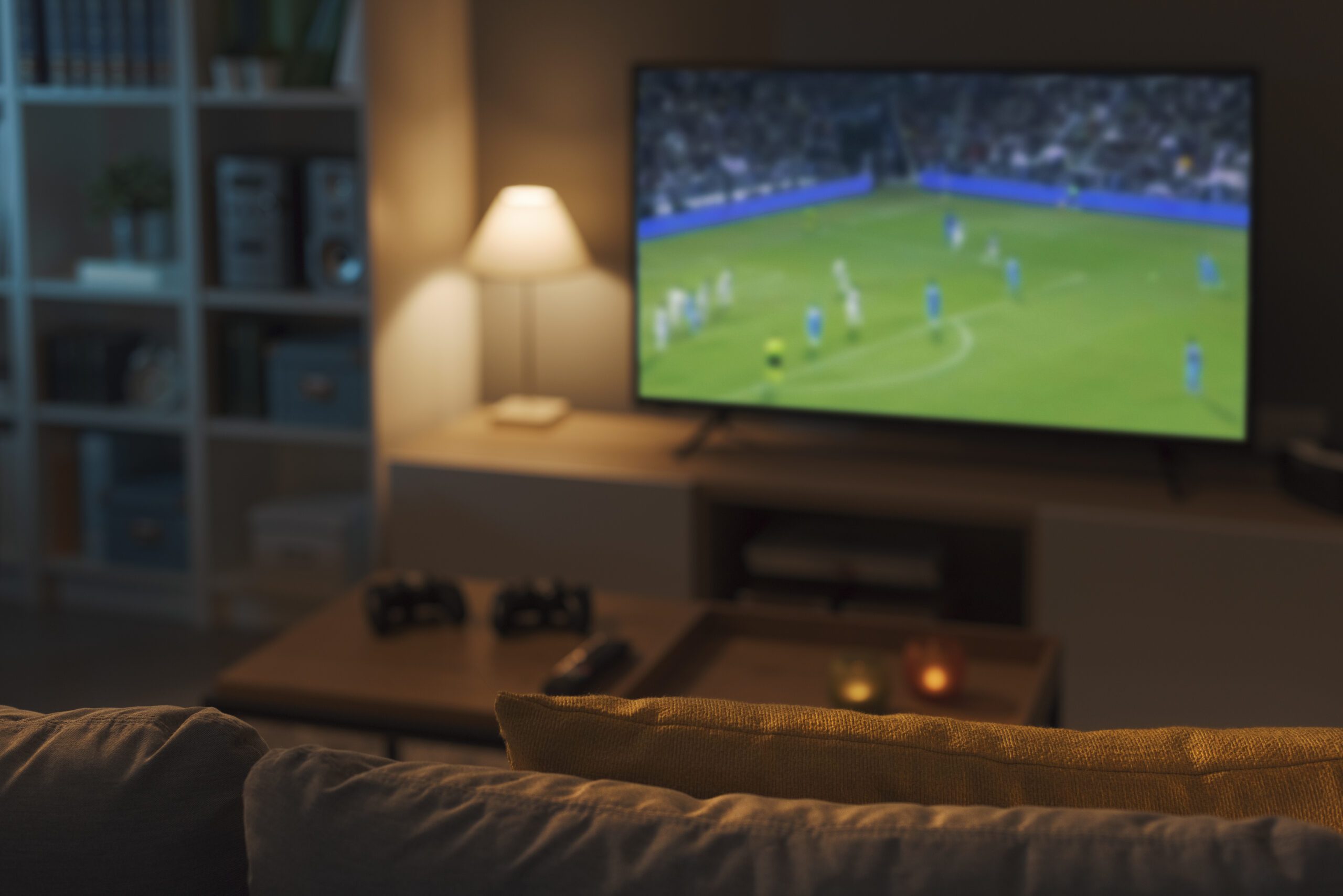 Football match live on TV, sports and entertainment concept